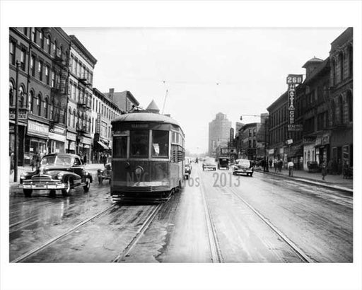 BQT Flatbush Trolley  with classic cars passing by in the background - Flatbush 1948 Brooklyn NY Old Vintage Photos and Images