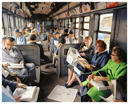 A vintage photograph of a crowded city bus interior with passengers seated in rows, reading newspapers and holding magazines. Passengers wear mid-century clothing, and posters and advertisements are visible along the bus walls and overhead.