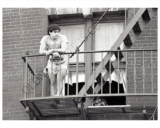 Guy on balcony Manhattan 1970