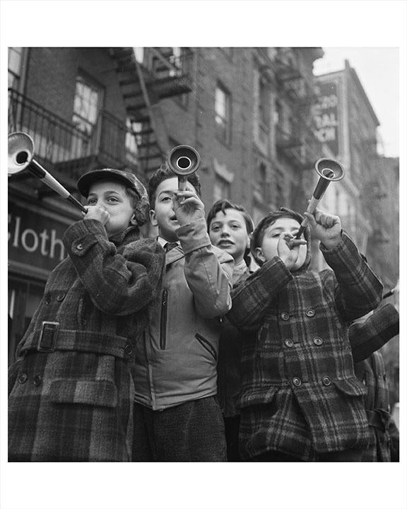 Photo of NYC Kids Blowing Horns On New Years Day