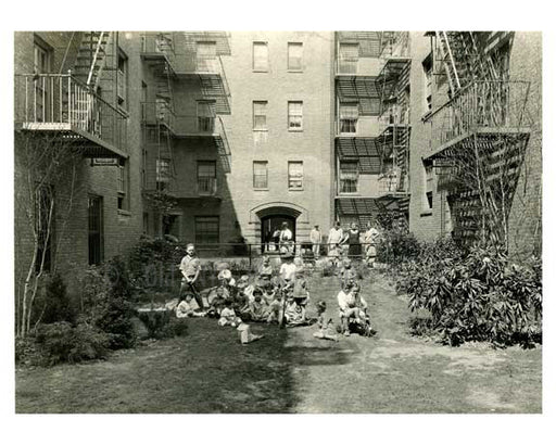 A family in their courtyard - Jackson Heights - Queens NY Old Vintage Photos and Images