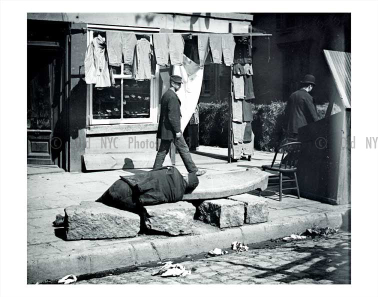 A man napping in Lower Manhattan Old Vintage Photos and Images