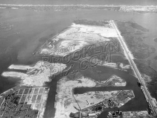 Aerial view of Barren Island, Bergen Beach, and Mill Basin, Rockaway Peninsula in distance; Flatbush Avenue on right, 1928 Old Vintage Photos and Images