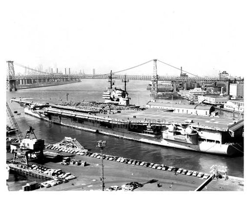 An aerial view of ships docked at the Navy Yard with the Williamsburg Bridge in the Background -  Brooklyn NY Old Vintage Photos and Images