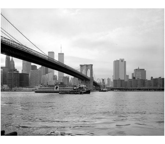 Brooklyn Bridge - view lookiong west from Brooklyn shore with ferry boat in the river 1982 Old Vintage Photos and Images