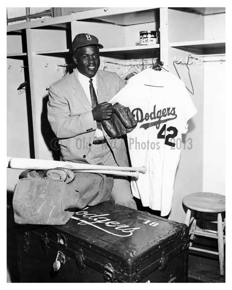 Brooklyn Dodger  Jackie Robinson retires from Baseball - seen packing up in the locker room at Ebbets Field - 1957 - Flatbush  - Brooklyn NY