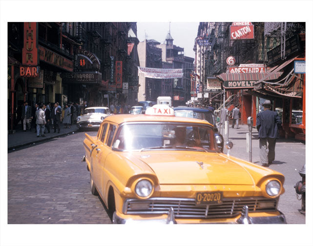 Classic Yellow taxi passing through Chinatown Old Vintage Photos and Images