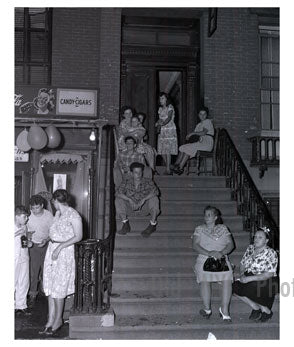 Family hanging out on the stoop of apt bldg. Old Vintage Photos and Images