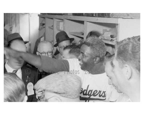 Jackie Robinson in the Dodgers locker room with the Press after the game