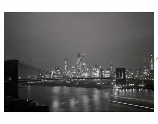 Manhattan lit up at night with Brooklyn Bridge in foreground Old Vintage Photos and Images