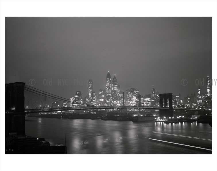 Manhattan lit up at night with Brooklyn Bridge in foreground Old Vintage Photos and Images