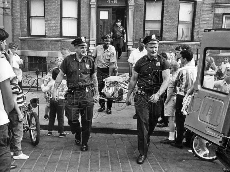 "New York's Finest" from 68th Precinct assisting injured person, c.1960 Old Vintage Photos and Images