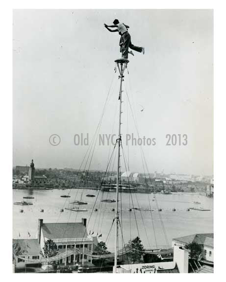 Performers atop a 140 foot pole in the amusement area at the World Fair 1939 Flushing  - Queens NYC Old Vintage Photos and Images