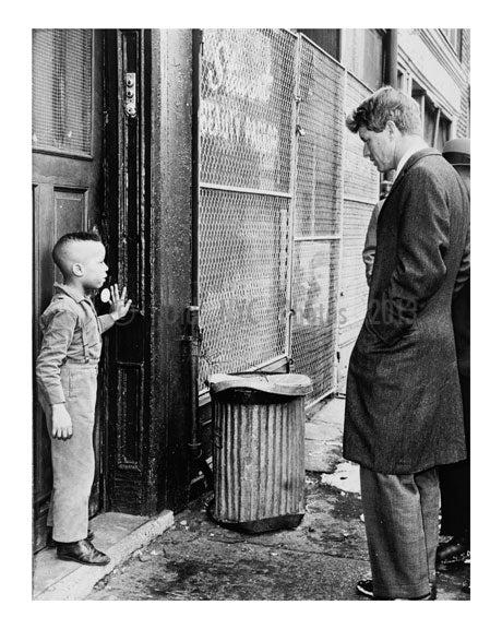 Senator Kennedy discusses school with young Ricky Taggart of 733 Gates Avenue Old Vintage Photos and Images