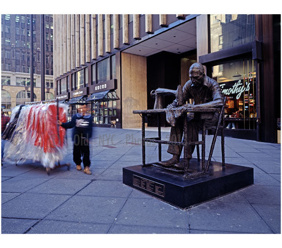 Statue of a garment worker on 7th Avenue in Manhattan in the heart of New York City's Garment District Old Vintage Photos and Images