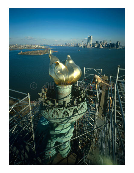 Statue of Liberty - new Torch & Flame with Manhattan Skyline in background - workers begin to dismantle the scaffolding Old Vintage Photos and Images