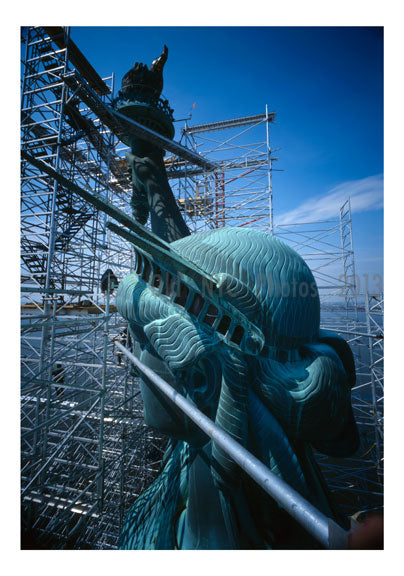 Statue of Liberty - view of left side of head looking at ear with torch arm in background Old Vintage Photos and Images