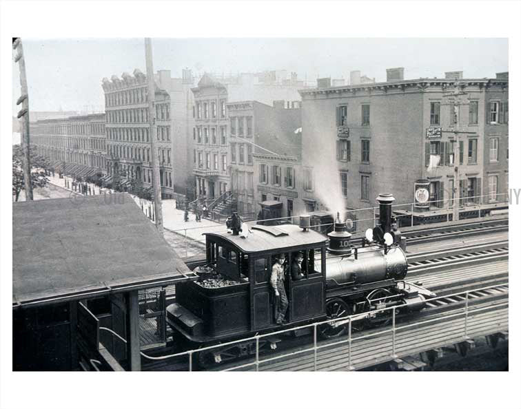 Trains on raised platform with city in view Old Vintage Photos and Images