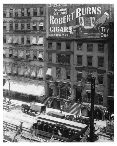 Up close shot of Union Square Park - under construction with a huge 'Robert Burns Cigars' Bilboard ona bldg. -July 1902 - New York, NY Old Vintage Photos and Images