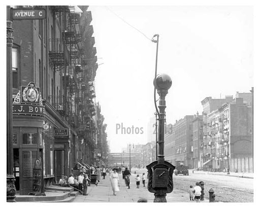 Upclose shot of the sidewalk scene Avenue C & East 14th Street - Alphabet City - Manhattan - New York, NY 1916 Old Vintage Photos and Images