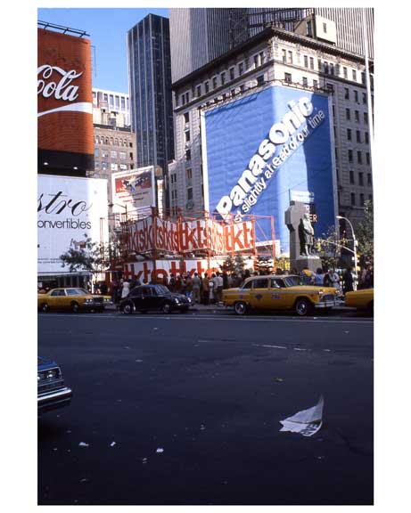 Yellow taxis pass through 1970s Times Square  with Panasonic& Coca Cola billboards in the background Old Vintage Photos and Images